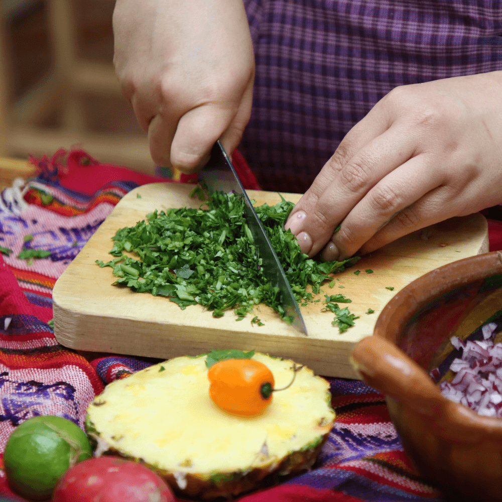 Natalie Luna chopping ingredients to make traditional Mexican salsa