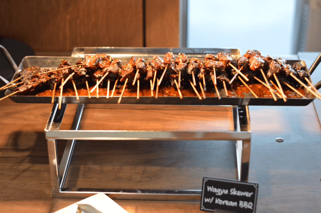 Speed Friending, an exploringnotboring event by Want2BeFriends. Image shows free food offered at the event, including Korean BBQ Wagyu Skewers.